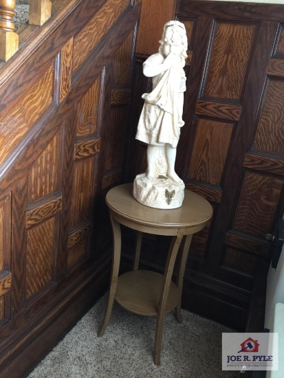 Wood round stand with tall little girl statue