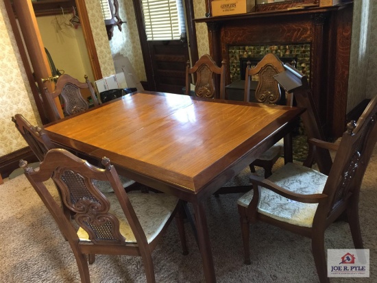 Modern dinning room table, six chairs, leaf, and matching china cabinet