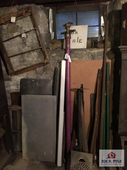 Lot on wall: roof jack, metal pipes, wood, etc.