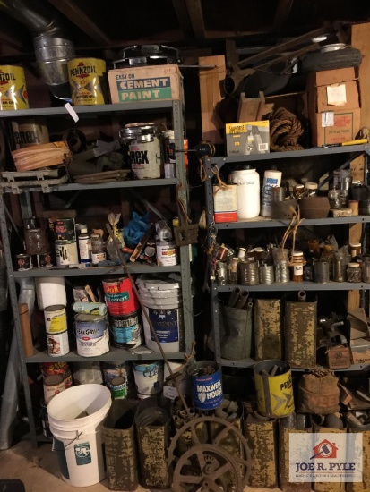 Two metal shelves and contents: fluids, hardware, plumbing, etc.
