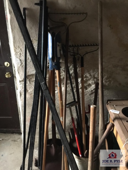 Lot of hand tools: Rakes, post hole digger, etc.