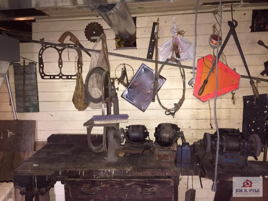 Workbench and contents to wall: motors, wood, wire etc.