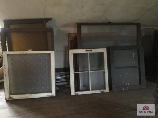 Lot of antique windows in attic. Original windows in house.