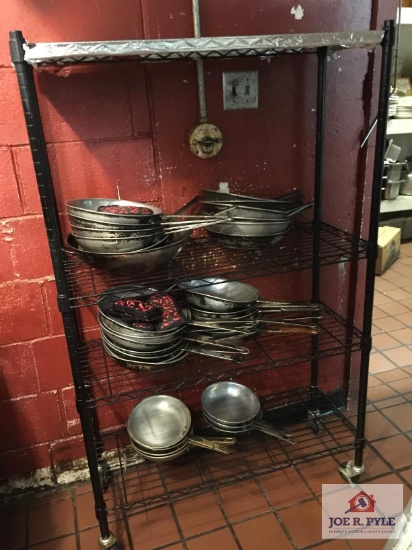 Metal storage rack and cooking skillets