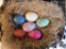 Six decorative alabaster eggs in nest