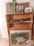 Shelf and contents of painting and hand stitched item