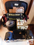 Lot: Nikkon 500mm lens, handbooks, rt. angle view attachment, auto ext., & camera case