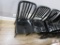 4 black aluminum chairs