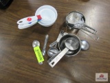 assorted measuring cups and spoons