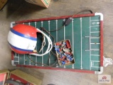 Vintage football game and helmet