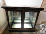 Small decorated lighted display case w/ gold trim