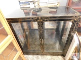 Black lacquered w/ gold trim lighted showcase