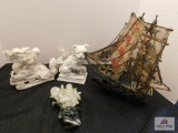 Metal painted boat, porcelain figurine, lion, baby riding a dragon and Confucius