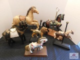 Carousel horses and 1 toy horse on wheels