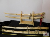 Carved bone swords w/scabbard on stand