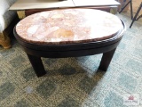Oval marble-topped coffee table