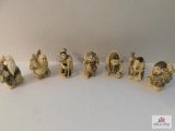 Small composite figurines oriental style workers