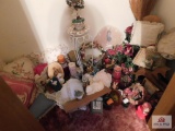 Contents of closet,, pillows, floral items, candles, shelves and stand