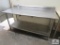 stainless steel table w backsplash approx. 30 inches wide, 72 inches long, 36 inches tall