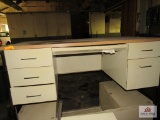 3 cream colored metal desks