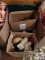 3 boxes of doll accessories: hats, wigs, shoes, and stands