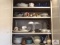 Contents of cabinet: china, pottery, tea pots, etc.