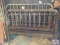 2 Antique twin wood beds and rails in garage