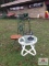 Metal folding chair, glass top table, candle holder