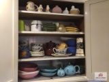 contents of cabinet: tea pots, plates, glassware, etc.