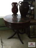 Leather top drum table (dmg leg) and 2 metal vases