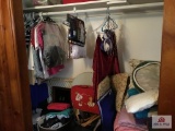 Contents of closet: clothing, bedding, blankets, pillows, etc.