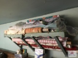 Large lot of bolt fabric on shelf