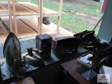 Lot of vintage irons on window sill