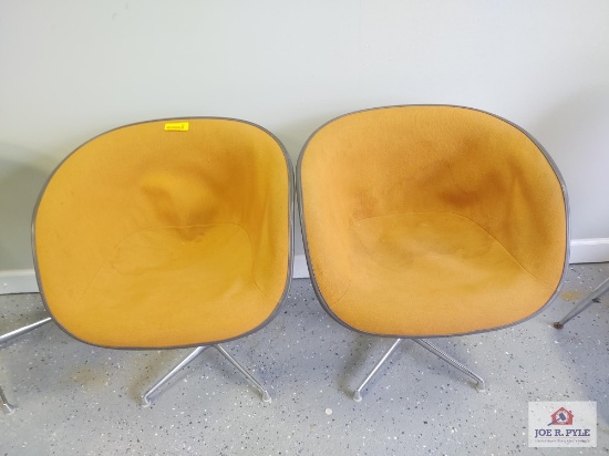2 Orange Herman Miller chairs