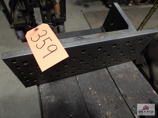 Adjustable hold down table