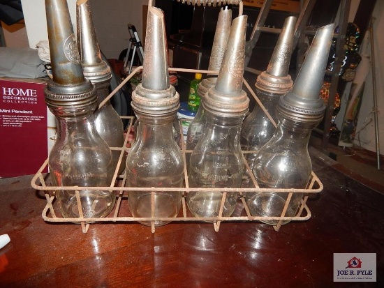 Eight 1-Quart oil bottles w/ spout and carrying basket