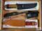 {133} Lot of (4) knives: (2) Whitetails commemorative knives, (1) Winchester NRA Bowie, (1) Legacy