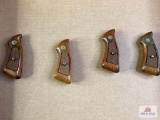 {148} Four sets of S&W grips (various sizes)