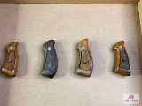 {149} Four sets of S&W grips (various sizes)