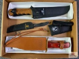 {133} Lot of (4) knives: (2) Whitetails commemorative knives, (1) Winchester NRA Bowie, (1) Legacy