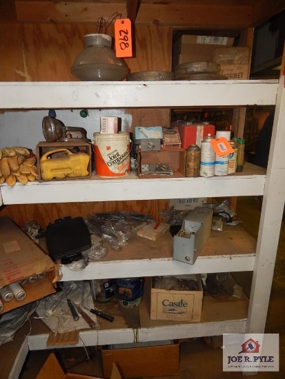 Contents of shelf; light fixtures, paint, etc.