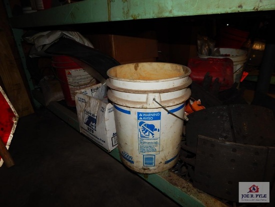 Lot of tire chains, bucket teeth, brake pads, bucket, etc.