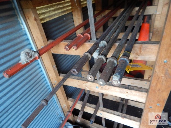 Approximately 16 pieces of drill steel