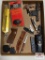 Flat of miscellaneous sportsmans items: knives, bow release, bow site, etc.