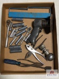 Flat of tools: pliers, sockets, air cut off tool, etc.