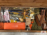 Wooden Footlocker and Contents: vest, turkey calls, cleaning supplies, leather belts, dial caliper,