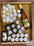 Flat of golf balls + tees