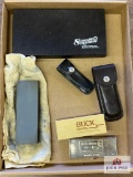 Lot of whetstones, Buck knife sheath/box, leather knife sheath, etc.