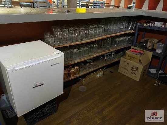 Contents of bar: wine cooler, mini fridge, glassware, supplies, menus, etc (not TV's)