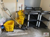 2 plastic serving carts & 2 mop buckets